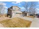 A beautiful two-story home featuring an attached two-car garage and manicured lawn at 5211 E 116Th Ave, Thornton, CO 80233