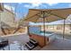 Relaxing backyard hot tub with umbrella and convenient steps for easy access at 5211 E 116Th Ave, Thornton, CO 80233