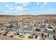 The houses below showcase neatly arranged streets and yards, set against a backdrop of distant hills at 3344 Evening Pl, Castle Rock, CO 80109