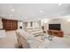 Finished basement with plush seating, entertainment center, recessed lighting and lots of space at 1844 S Jay Way, Lakewood, CO 80232