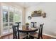 Cozy dining area featuring wood table, seating for four, and bright natural light at 1844 S Jay Way, Lakewood, CO 80232