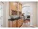 Hallway featuring custom cabinetry, wine racks, and granite countertop at 1844 S Jay Way, Lakewood, CO 80232