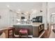 Spacious kitchen with a functional island, custom cabinets, and modern lighting at 1844 S Jay Way, Lakewood, CO 80232