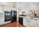 Bright kitchen featuring granite countertops, stainless steel appliances, and custom cabinetry at 1844 S Jay Way, Lakewood, CO 80232