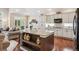 Open concept kitchen features granite countertops, a kitchen island, and seamless flow into the living space at 1844 S Jay Way, Lakewood, CO 80232