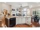 Open kitchen overlooking the Gathering room, featuring a large island, stainless steel appliances, and a breakfast nook at 1844 S Jay Way, Lakewood, CO 80232