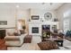 Warm living room with a fireplace, mantel, and comfortable seating arrangement at 1844 S Jay Way, Lakewood, CO 80232