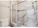 Tiled shower with glass door, seating area and mosaic accents at 1844 S Jay Way, Lakewood, CO 80232