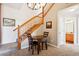 Carpeted dining area adjacent to stairs and a view into the bathroom at 8778 S Kipling Way # 304, Littleton, CO 80127
