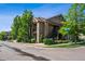 Apartment building exterior with balconies and mature landscaping at 8778 S Kipling Way # 304, Littleton, CO 80127