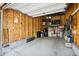 Spacious two-car garage with a mix of wood and concrete. Cluttered but very usable at 8778 S Kipling Way # 304, Littleton, CO 80127