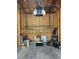 Unfinished garage with storage and a Chamberlain garage door opening system at 8778 S Kipling Way # 304, Littleton, CO 80127