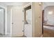 Convenient laundry closet in the hallway with a stacked washer and dryer set at 8778 S Kipling Way # 304, Littleton, CO 80127