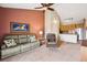 Inviting living room with ceiling fan and vaulted ceilings adjacent to the kitchen at 8778 S Kipling Way # 304, Littleton, CO 80127