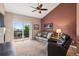 Bright living room with sliding glass door leading to balcony with beautiful outdoor view at 8778 S Kipling Way # 304, Littleton, CO 80127