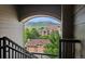 Scenic view through an archway featuring mountains and nearby houses at 8778 S Kipling Way # 304, Littleton, CO 80127