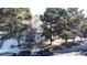 An aerial view of townhomes surrounded by mature trees with street parking available at 4084 S Carson St # A, Aurora, CO 80014