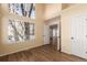 Well-lit bedroom with hardwood floors and access to hallway at 4084 S Carson St # A, Aurora, CO 80014