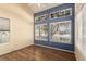 Bright bedroom with neutral paint, vinyl floor and natural light from large windows at 4084 S Carson St # A, Aurora, CO 80014