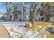 Front view of two-story townhome, winter scene at 4084 S Carson St # A, Aurora, CO 80014