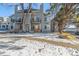 Rear view of two-story townhome, winter scene at 4084 S Carson St # A, Aurora, CO 80014