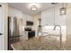 Well-lit kitchen with white cabinets, stainless steel appliances, and granite counters at 4084 S Carson St # A, Aurora, CO 80014