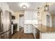 Modern kitchen with stainless steel appliances, granite countertops, and white cabinetry at 4084 S Carson St # A, Aurora, CO 80014