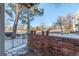 Small patio with brick wall and view of neighborhood at 4084 S Carson St # A, Aurora, CO 80014