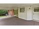 The outdoor patio features a wood floor and white wood siding at 8304 Eaton Way, Arvada, CO 80003
