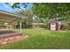 A backyard with a wood shed and privacy fence at 8304 Eaton Way, Arvada, CO 80003