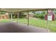 Enjoy the backyard from this home's covered deck area with wood-look flooring at 8304 Eaton Way, Arvada, CO 80003
