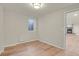 Finished basement area with laminate flooring, window and view into the adjacent Gathering room at 8304 Eaton Way, Arvada, CO 80003