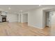 Spacious finished basement featuring a stone fireplace and laminate flooring at 8304 Eaton Way, Arvada, CO 80003