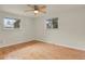 Bright bedroom with two windows and hardwood flooring at 8304 Eaton Way, Arvada, CO 80003