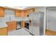 A kitchen features stainless steel appliances, light wood cabinets, and white subway tile backsplash at 8304 Eaton Way, Arvada, CO 80003