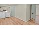 Bright laundry room features washer, dryer, and wood-look floors at 8304 Eaton Way, Arvada, CO 80003