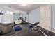 Basement gym featuring rubber flooring, a hot tub, exercise bike, and workout bench at 9241 Roadrunner St, Highlands Ranch, CO 80129