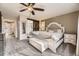 Spacious primary bedroom featuring a large window for natural light and an ensuite bathroom at 9241 Roadrunner St, Highlands Ranch, CO 80129