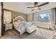 Primary bedroom featuring a large window for natural light and an ensuite bathroom at 9241 Roadrunner St, Highlands Ranch, CO 80129