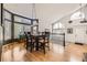 Dining area with hardwood floors, large windows, and modern chandelier at 9241 Roadrunner St, Highlands Ranch, CO 80129