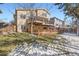 Exterior backyard view featuring a multi-tiered deck and fenced-in yard at 9241 Roadrunner St, Highlands Ranch, CO 80129