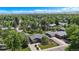 An aerial view shows a neighborhood with manicured lawns and mature trees, providing a serene and picturesque setting at 6868 S Birch Way, Centennial, CO 80122