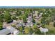 This aerial shows a charming residential neighborhood with mature trees, sidewalks and views of the city skyline in the distance at 6868 S Birch Way, Centennial, CO 80122