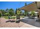Inviting backyard patio with comfortable seating, lush landscaping, and an outdoor dining area at 6868 S Birch Way, Centennial, CO 80122
