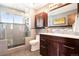 Modern bathroom with glass shower and dark wood cabinets at 6868 S Birch Way, Centennial, CO 80122