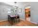 Dining room with hardwood floors and views of the kitchen at 6868 S Birch Way, Centennial, CO 80122