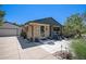 Quaint home featuring brick and gray siding and a detached garage at 6868 S Birch Way, Centennial, CO 80122