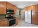 Functional kitchen with modern appliances and plenty of counter space at 6868 S Birch Way, Centennial, CO 80122