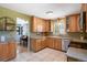 Spacious kitchen featuring stainless steel appliances, great cabinets, and tile floors at 6868 S Birch Way, Centennial, CO 80122