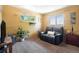 Cozy living room with a black leather loveseat and natural light, great for relaxing at 6868 S Birch Way, Centennial, CO 80122